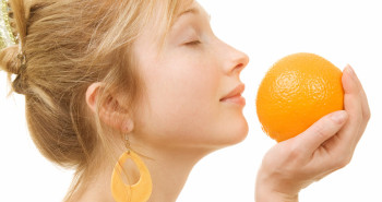 woman holding an orange