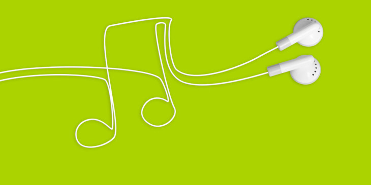 earbuds and music note on green background