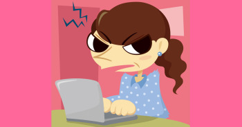 woman scowling using laptop